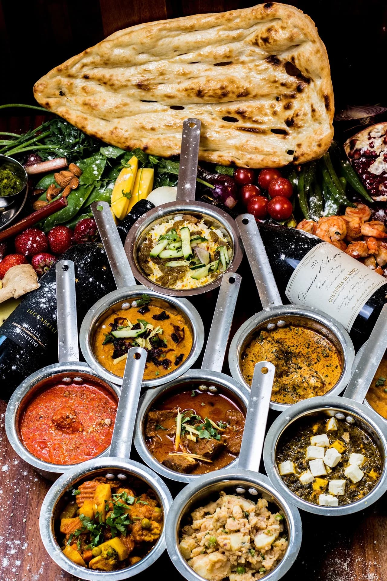 A spread of curries, rice and naan bread